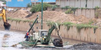 Akufo Addo tours drainage system