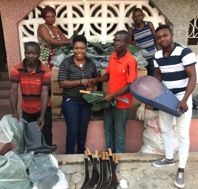 Rachel Appoh handing over the items to the leadership of Gomoa Youth in Agric