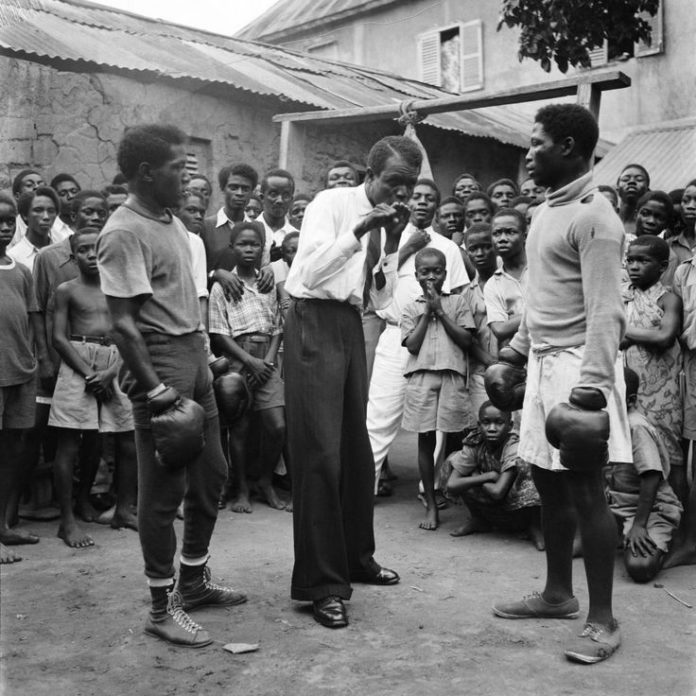 Roy Ankrah with two amateur boxers