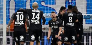 Amiens players celebrate scoring a goal against Marseille