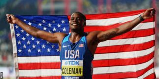 Christian Coleman celebrates his gold medal at the Doha World Championships in 2019