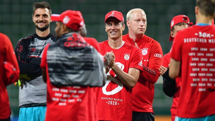 Robert Lewandowski of Bayern Munich wears a shirt and cap in celebration of securing the Bundesliga title following their victory in the Bundesliga match between SV Werder Bremen and FC Bayern Muenchen Image credit: Getty Images