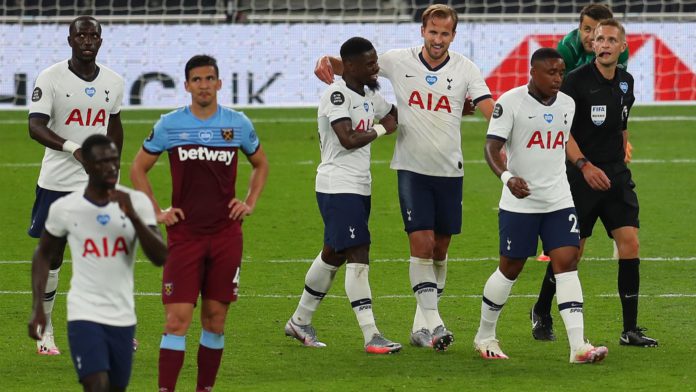 Harry Kane of Tottenham Hotspur celebrates with teammate Serge Aurier after scoring his team's second goal during the Premier League match between Tottenham Hotspur and West Ham United at Tottenham Hotspur Stadium on June 23, 2020 in London, England Image credit: Getty Images