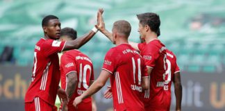 Robert Lewandowski of Bayern Muenchen celebrates the third goal for his team with Michael Cuisance of Bayern Muenchen and David Alaba of Bayern Muenchen during the Bundesliga match between VfL Wolfsburg and FC Bayern Muenchen at Volkswagen Arena on June 2 Image credit: Getty Images