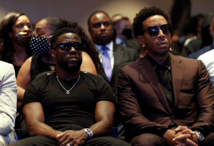 Actor Kevin Hart and musician Ludacris are seen during a memorial service for George Floyd today.REUTERS