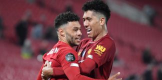 Alex Oxlade-Chamberlain (L) celebrates with Roberto Firmino after scoring for Liverpool against Chelsea. Image credit: Getty Images