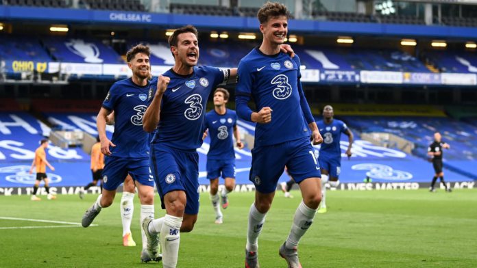 Mason Mount of Chelsea celebrates with teammate Cesar Azpilicueta after scoring his team's first goal during the Premier League match between Chelsea FC and Wolverhampton Wanderers at Stamford Bridge on July 26, 2020 in London, England. Football Stadiums Image credit: Getty Images