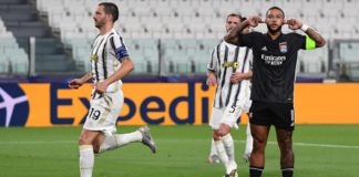 Lyon's Dutch forward Memphis Depay (R) celebrates scoring his team's first goal during the UEFA Champions League round of 16 second leg football match between Juventus and Olympique Lyonnais (OL), played behind closed doors due to the spread of the COVID- Image credit: Getty Images