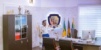 Shatta Wale makes a call in his personal "Shatta Movement" office /Photo Credit: @kwabenaawuku