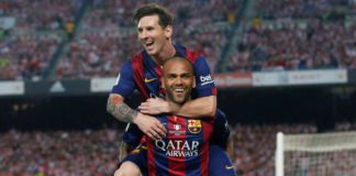 Dani Alves celebrates with Lionel Messi