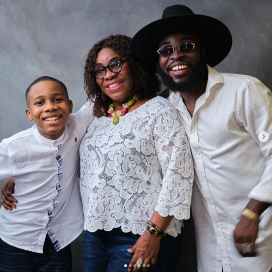 M.anifest and mother in family photo