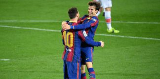 Barcelona's Argentinian forward Lionel Messi celebrates with Barcelona's Spanish midfielder Riqui Puig Image credit: Getty Images