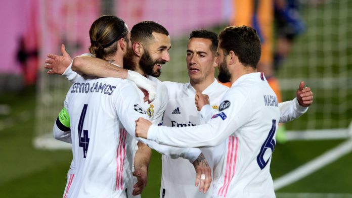 Sergio Ramos of Real Madrid celebrates with team mates after scoring their side's second during the UEFA Champions League Round of 16 match between Real Madrid and Atalanta at Estadio Alfredo Di Stefano on March 16, 2021 in Madrid, Spain. Image credit: Getty Images