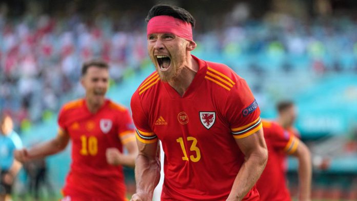 Wales' midfielder Kieffer Moore celebrates after scoring the equaliser during the UEFA EURO 2020 Group A football match between Wales and Switzerland at the Olympic Stadium in Baku on June 12, 2021. Image credit: Getty Images