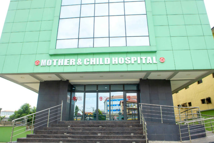 Doctors at Mother & Child Hospital operate with rechargeable lamps