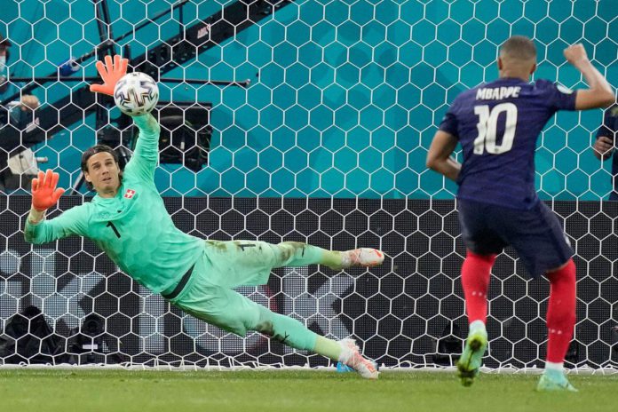 Yann Sommer saves Kylian Mbappe's penalty