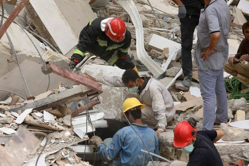 Two young brothers killed in building collapse found hugging in rubble ...