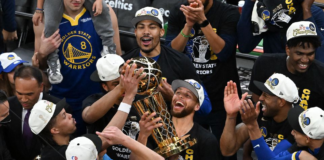 Jun 16, 2022; Boston, Massachusetts, USA; Golden State Warriors guard Stephen Curry (30) holds up the Larry O'Brien Trophy after defeating the Boston Celtics in game six of the 2022 NBA Finals at TD Garden. Mandatory Credit: Bob DeChiara-USA TODAY Sports/ Image Credit: REUTERS