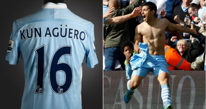 Aguero tore off the shirt, which is stained with both mud and champagne, in celebration