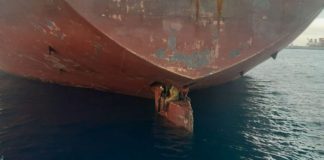 The Spanish coastguard rescued three migrants stowed away on the rudder. Pic: Salvamento Maritimo