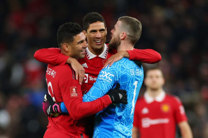 Manchester United players celebrate progression to the quarter-finals of the FA Cup (Image: Marc Atkins/Getty Images)