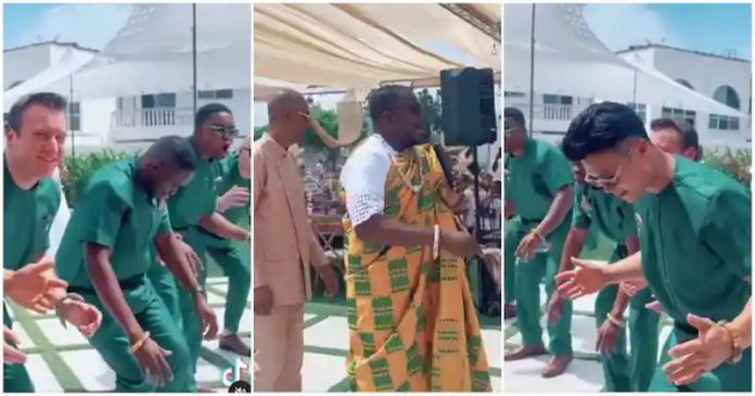 White friends of a Ghanaian groom struggled to dance agbadza in funny trending wedding video Photo source: @giovani.caleb