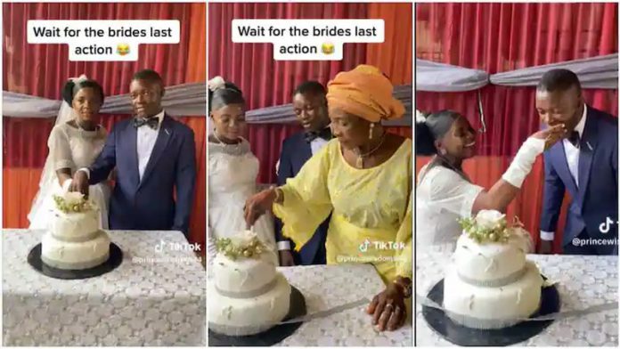 The husband was fed the cake by his bride. Photo source: @princewisdom544