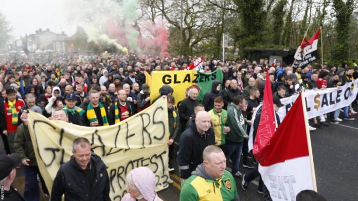 Manchester United fans marched from the city centre to the club's Old Trafford stadium