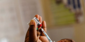 A nurse fills a syringe with malaria vaccine before administering it to an infant at the Lumumba Sub-County hospital in Kisumu, Kenya, July 1, 2022. REUTERS/Baz Ratner