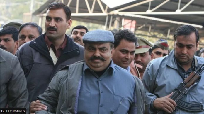 Atiq Ahmed, seen here outside a Delhi court in 2008, was one of India's most dreaded gangster-politicians