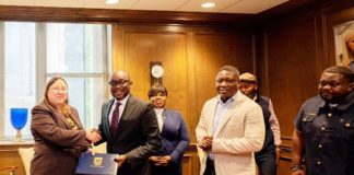 Dr Kingsley Agyemang (2nd from left), the Registrar of the Ghana Scholarship Secretariat, exchanging the signed documents with Dr Abby Parrill-Baker (left), Interim Provost of the University of Memphis. With them is Richard Gyamfi (right), Head of International Relations & Partnerships of Ghana Scholarship Secretariat