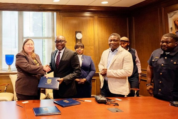 Dr Kingsley Agyemang (2nd from left), the Registrar of the Ghana Scholarship Secretariat, exchanging the signed documents with Dr Abby Parrill-Baker (left), Interim Provost of the University of Memphis. With them is Richard Gyamfi (right), Head of International Relations & Partnerships of Ghana Scholarship Secretariat