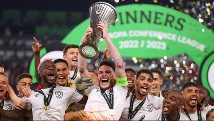 Declan Rice of West Ham United lifts the UEFA Europa Conference League trophy after the team's victory during the UEFA Europa Conference League 2022/23 final match between ACF Fiorentina and West Ham United FC at Eden Arena. Image credit: Getty Images