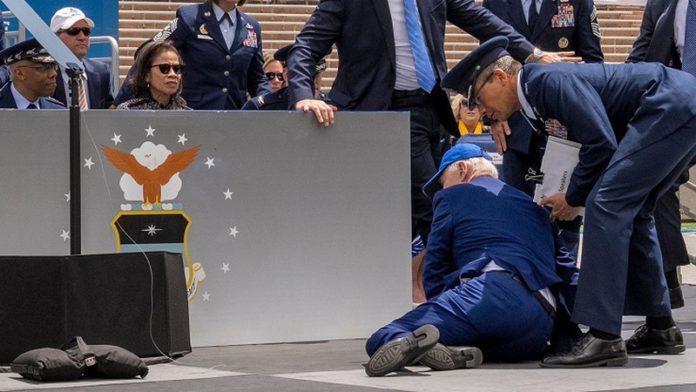 US President Joe Biden trips and falls during US Airforce graduation ceremony