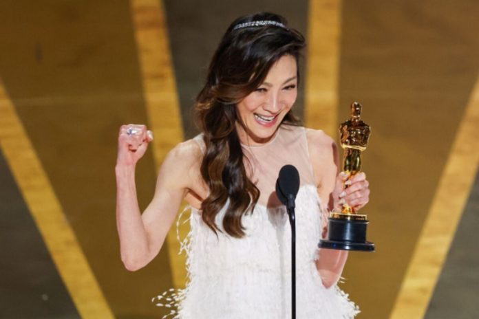 Michelle Yeoh accepts the award for Actress in a Leading Role at the 95th Academy Awards in the Dolby Theatre.(Myung J. Chun/Los Angeles Times)