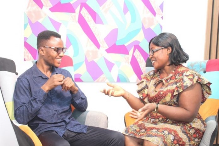 Mrs Vasty Agyeiwaa Sarkodie interacting with her hearing impaired son, Michael Gyamfi Sekyere through sign language Picture: Ernest Kodzi