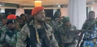 A man in military fatigues speaks as others stand next to him inside the Palace of the Nation during an attempted coup in Kinshasa, Democratic Republic of Congo, May 19, 2024, in this screen grab from a social media video. Christian Malanga/Reuters