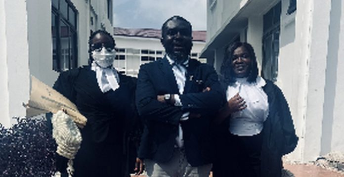 Ama Governor (in mask) with Oliver Barker-Vormawor (middle) and a colleague lawyer