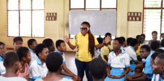 MTN staff volunteer engaging with students of Christ the King SHS in the Ashanti region