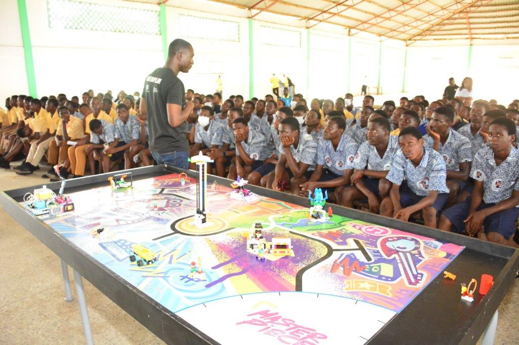 One of the partners taking students through Robotics