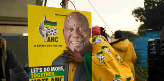 African National Congress (ANC) polling agents set up a tent decorated with party paraphernalia outside a polling station in Umlazi on May 29, during South Africa's general election. Zinyange Auntony/AFP via Getty Images