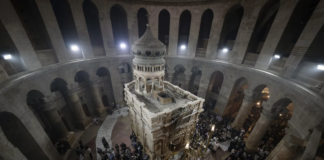 Latin Patriarch of Jerusalem Pierbattista Pizzaballa leads the Easter Sunday Mass at the Church of the Holy Sepulchre, where many Christians believe Jesus was crucified, buried and rose from the dead, in the Old City of Jerusalem, Sunday, March 31, 2024. The heads of major Christian denominations in Israel say that local governments across the country are demanding they pay property tax, violating a longstanding arrangement in a manner they say reflects growing intolerance for Christians in the Holy Land. (AP Photo/Leo Correa, File)