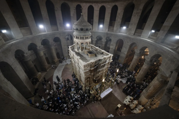 Latin Patriarch of Jerusalem Pierbattista Pizzaballa leads the Easter Sunday Mass at the Church of the Holy Sepulchre, where many Christians believe Jesus was crucified, buried and rose from the dead, in the Old City of Jerusalem, Sunday, March 31, 2024. The heads of major Christian denominations in Israel say that local governments across the country are demanding they pay property tax, violating a longstanding arrangement in a manner they say reflects growing intolerance for Christians in the Holy Land. (AP Photo/Leo Correa, File)