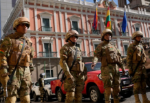 Soldiers stand guard outside the presidential palace in Plaza Murillo in La Paz, Bolivia. (AP Photo/Juan Karita)COPYRIGHT 2024 THE ASSOCIATED PRESS. ALL RIGHTS RESERVED