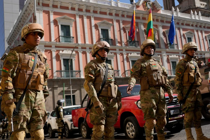 Soldiers stand guard outside the presidential palace in Plaza Murillo in La Paz, Bolivia. (AP Photo/Juan Karita)COPYRIGHT 2024 THE ASSOCIATED PRESS. ALL RIGHTS RESERVED