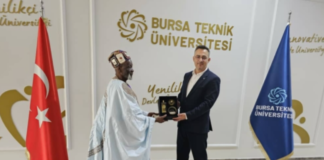 Ya-Na Abukari II receiving a souvenir from Prof Dr. Naci Caglar, VC of Bursa Technical University in Bursa, Turkey after a co-operation meeting.