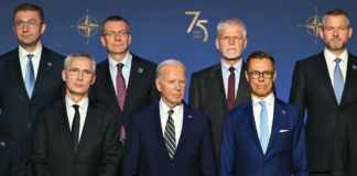 President Joe Biden, flanked by NATO Secretary General Jens Stoltenberg, left, and President of Finland Alexander Stubbs, right, stands with NATO leaders for a group photo during the NATO 75th Anniversary Celebratory Event at the Mellon Auditorium in Washington, DC, on July 9. Saul Loeb/AFP/Getty Images