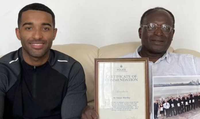 Nelson Shardey (r), seen here with his son Jacob, won a police commendation for bravery