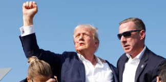 Republican presidential candidate former President Donald Trump is rushed offstage during a rally on July 13, 2024 in Butler, Pennsylvania