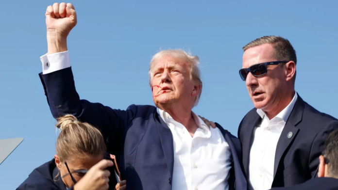 Republican presidential candidate former President Donald Trump is rushed offstage during a rally on July 13, 2024 in Butler, Pennsylvania